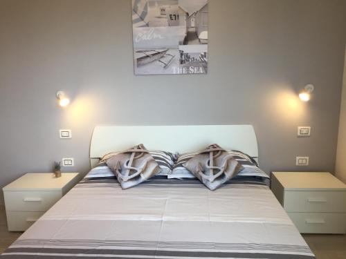 Katil atau katil-katil dalam bilik di Le Domus Modern Apartments Cagliari