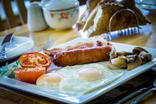 a plate of breakfast food on a table at Orchard Lodge & Wolds Restaurant in Cayton