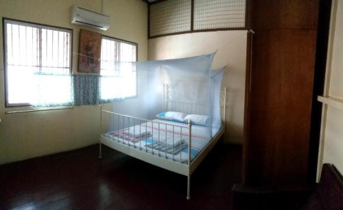 Una cama o camas en una habitación de Voyage Guesthouse