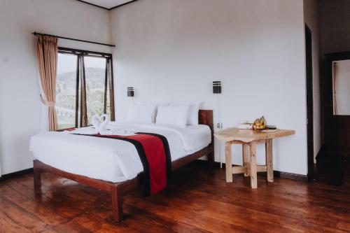 Кровать или кровати в номере Candra Cottage