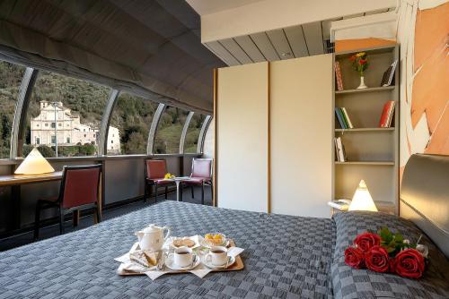a hotel room with a table with plates of food at Albornoz Palace Hotel in Spoleto