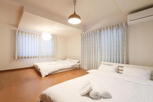 Voodi või voodid majutusasutuse Tokaichi inn 一軒家貸切 toas