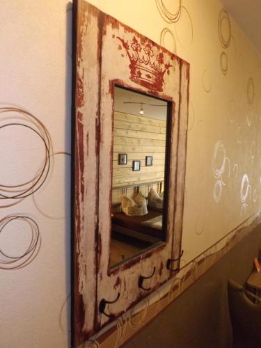 an old mirror on the wall in a room at Haus Oberkassel in Bonn