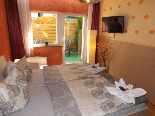 a bedroom with a bed with white flowers on it at Haus Oberkassel in Bonn
