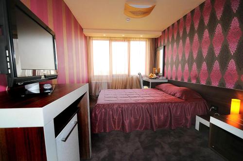 Postel nebo postele na pokoji v ubytování Hotel Leipzig