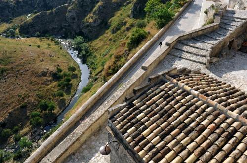 a view of the great wall of china and a river at Sextantio Le Grotte Della Civita in Matera