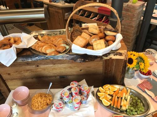 a table with many different types of bread and pastries at ZUM BAHNHÖFLE Restaurant & Hotel - Albbruck Am Rhein in Albbruck