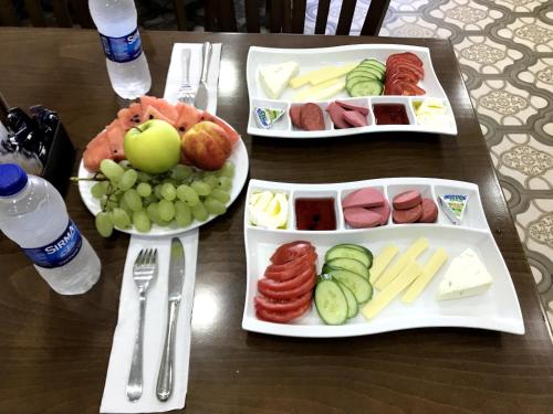 a table with three trays of food on it at Babel Park Hotel in Istanbul