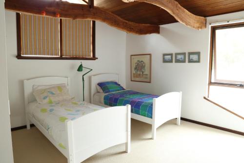 Ένα ή περισσότερα κρεβάτια σε δωμάτιο στο Anagama House & Studio