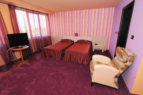 Postel nebo postele na pokoji v ubytování Hotel Leipzig