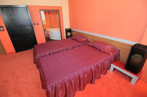 Postel nebo postele na pokoji v ubytování Hotel Leipzig