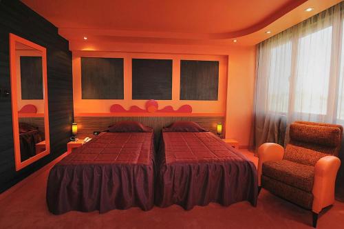 Postel nebo postele na pokoji v ubytování Hotel Leipzig