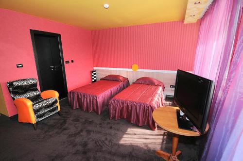 Postel nebo postele na pokoji v ubytování Hotel Leipzig