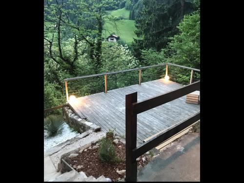 a wooden deck with lights on top of a mountain at Knottn Hüttl, St. Pankraz/Ulten, Nähe Meran in San Pancrazio dʼUltimo
