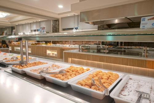 a buffet line with many different types of food at Elea Beach Hotel in Dassia