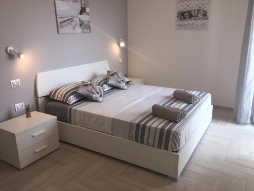 Katil atau katil-katil dalam bilik di Le Domus Modern Apartments Cagliari