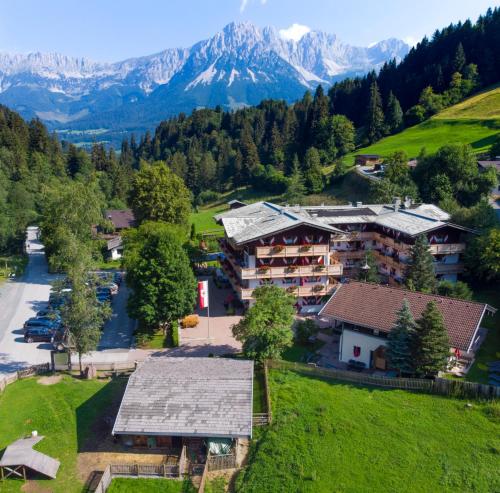 an aerial view of a resort with mountains in the background at Ferienappartements Landhof in Ellmau