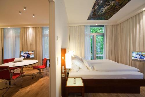 Кровать или кровати в номере Grand Hotel Mussmann