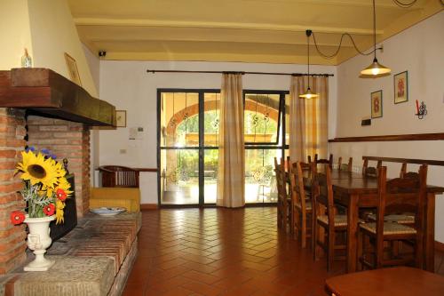 a living room with a table and a dining room at Il Casolare in Penna