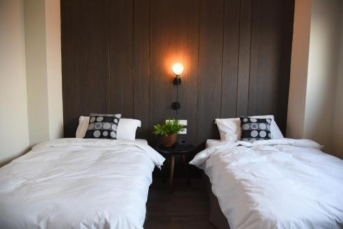 Katil atau katil-katil dalam bilik di Wountain Hotel