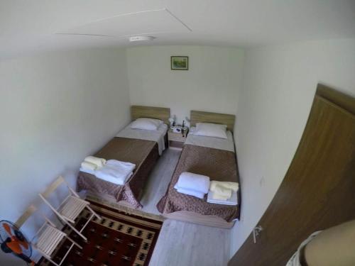 an overhead view of a room with two beds at Garden Guesthouse in Gjakove
