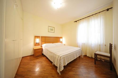 Posteľ alebo postele v izbe v ubytovaní Girica Apartments