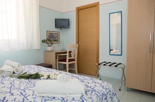 Un pat sau paturi într-o cameră la B&B Piazza Vittorio