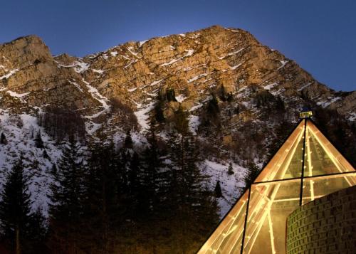 a ski lodge with a mountain in the background at Val di Luce SPA Resort in Abetone