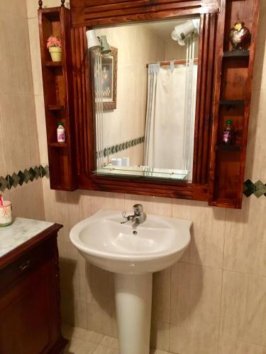 a bathroom with a sink and a mirror at Casa Carmelito in Moya