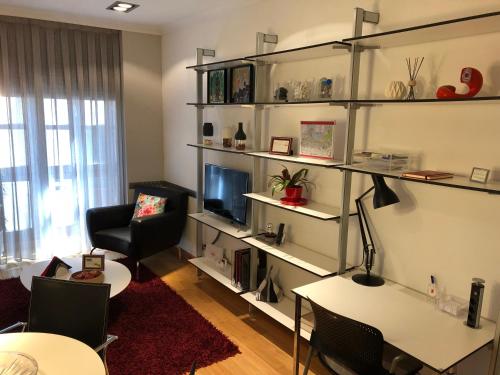 TV a/nebo společenská místnost v ubytování Espacio Gijón Centro