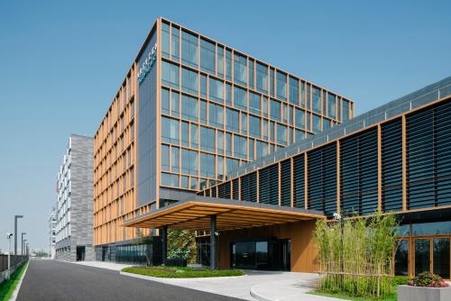 a large office building with a lot of windows at Artyzen Habitat Hongqiao Shanghai - Korean Street in Shanghai