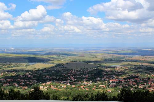 an aerial view of a city with houses and trees at Zaara Estate Winery Hotel & SPA in Glavan