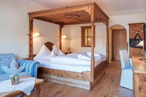 Łóżko lub łóżka w pokoju w obiekcie Sonnenhof Genusshotel & Appartements