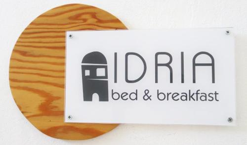 a sign that says india bed and breakfast on a wall at Idria B&B in Barcellona-Pozzo di Gotto