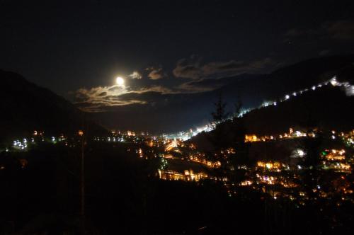 a view of a city lit up at night at Apartment Bad Kleinkirchheim in Bad Kleinkirchheim