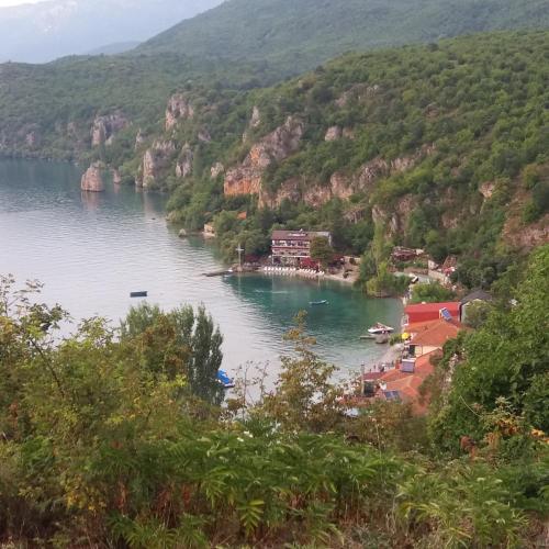 a view of a body of water with mountains in the background at Rooms and Apartaments De Niro in Trpejca