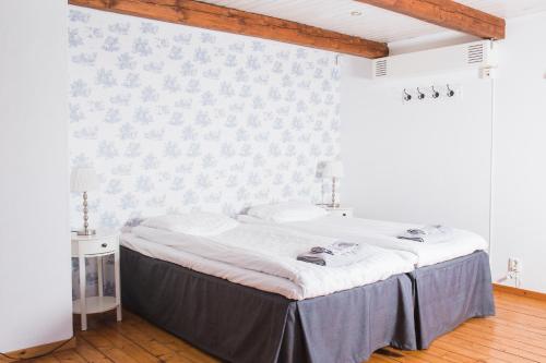 Кровать или кровати в номере Landet Bed and Breakfast