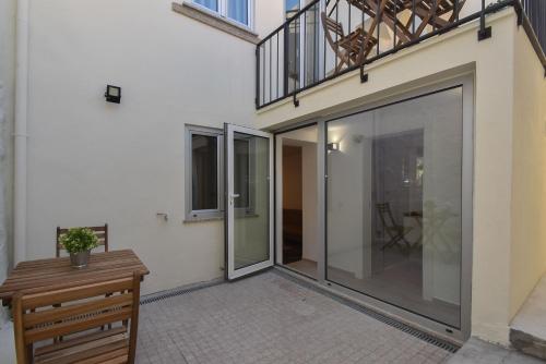 a sliding glass door on the side of a building at Oporto Lovely House in Porto