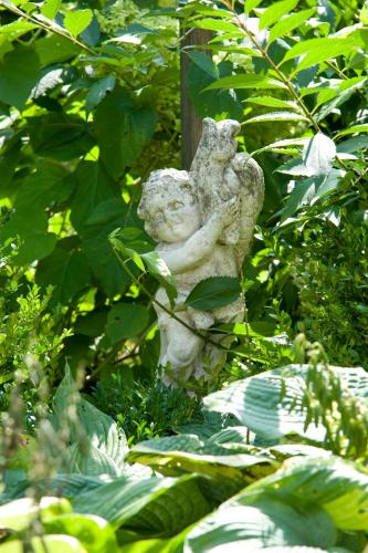 a statue of a woman holding a bird at Hotel Garni Glockenstuhl in Mayrhofen