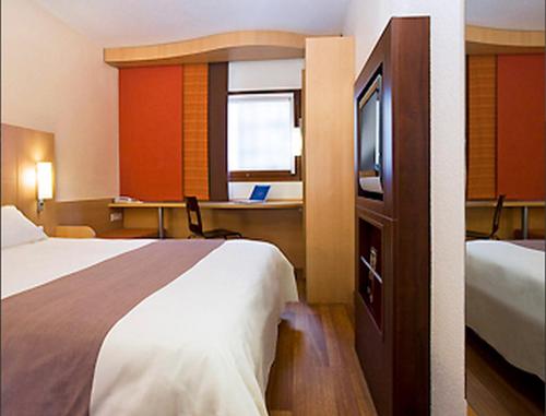 Postel nebo postele na pokoji v ubytování ibis Lyon Est Beynost