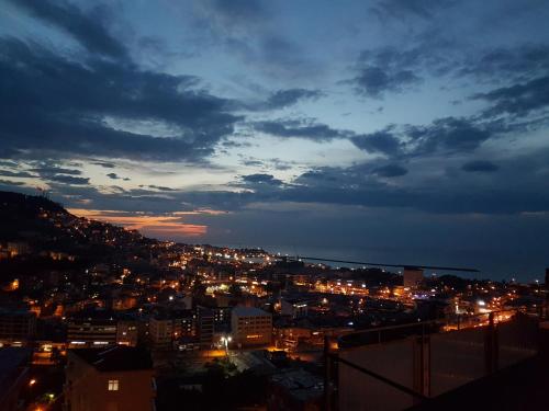 a view of a city at night with lights at NURALP APART OTEL - Trabzon in Trabzon