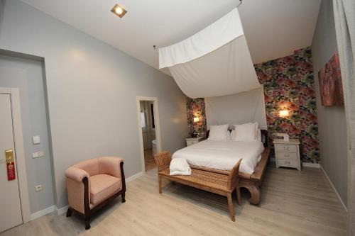 Ένα ή περισσότερα κρεβάτια σε δωμάτιο στο Hotel Château Viñasoro