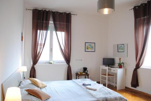 Postel nebo postele na pokoji v ubytování Dreaming Verona Rooms