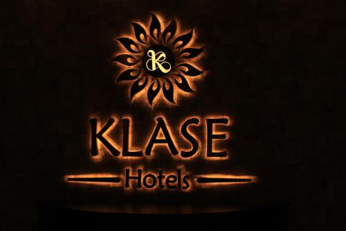 a neon sign that says knee horoscopes at Klase Hotels in Chennai