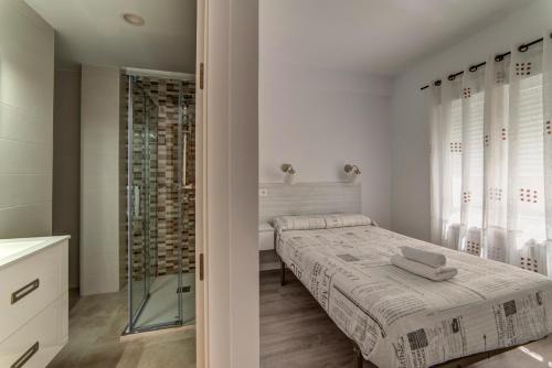 Ένα ή περισσότερα κρεβάτια σε δωμάτιο στο Hostal Lar