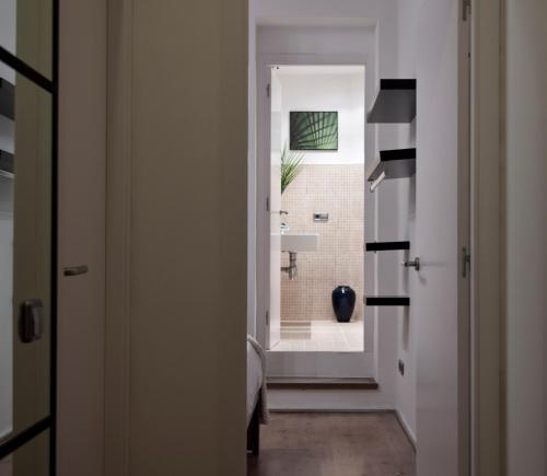 a kitchen with a door open and a window at Centric Gracia Apartments in Barcelona