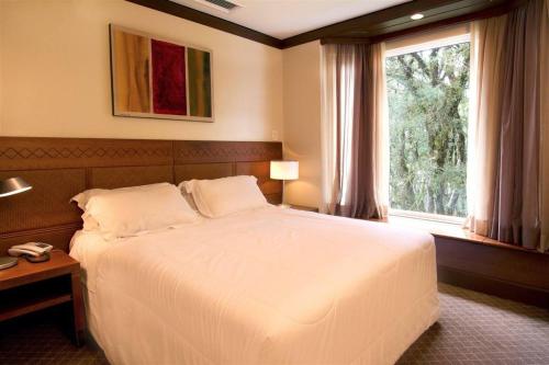 Ένα ή περισσότερα κρεβάτια σε δωμάτιο στο FLAT PRESTIGE SERRA RS 5*