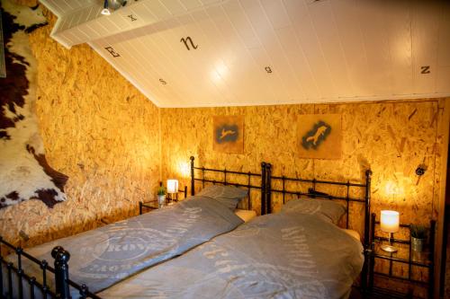 Säng eller sängar i ett rum på The BlackSmith's House