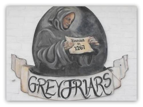 a painting of a man holding a sign at Greyfriars Lodge Canterbury in Canterbury