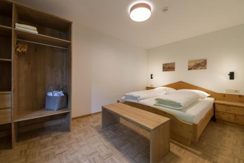 Postel nebo postele na pokoji v ubytování Residence Edelweiss